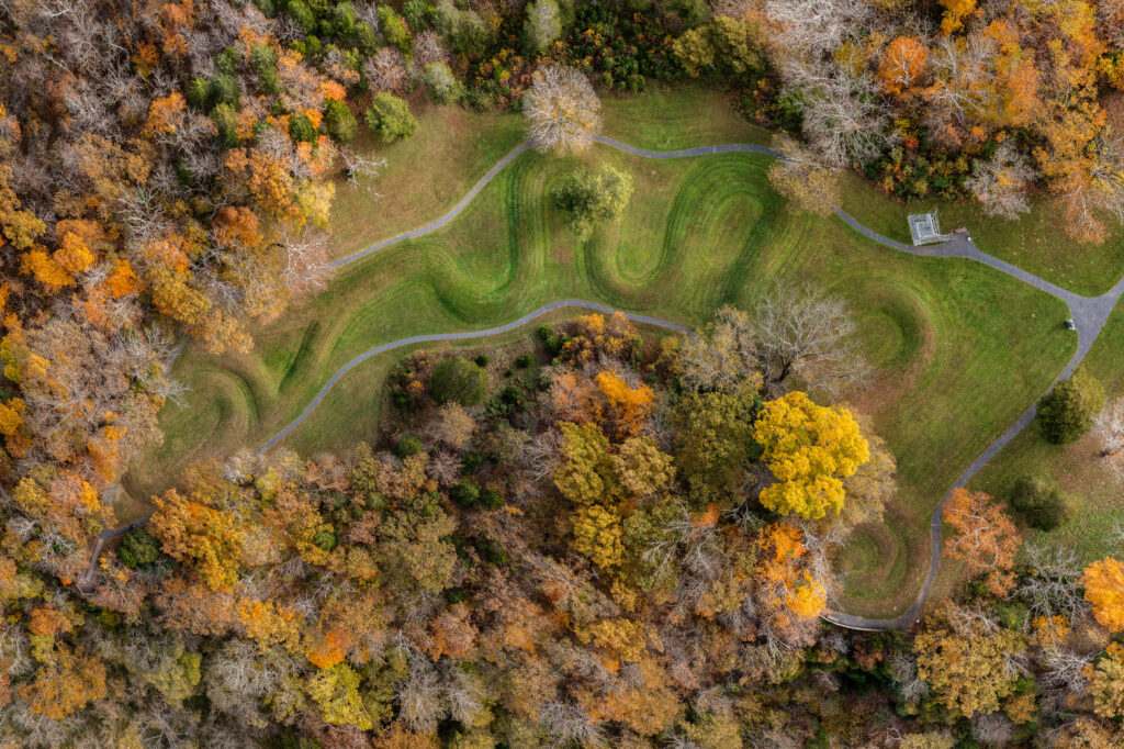 The Great Serpent Mound in Adams County Ohio is the largest serpent effigy mound on Earth. It is more that 1,300 feet from tip to head. The Great Serpent is thought to be 1,000 years old. It is situated on a bluff above Ohio Brush Creek. This image is an aerial composite photo of Serpent Mound in Adams County Ohio. Shot with permission of the Serpent Mound site manager.